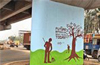 Volunteers paint pillar of Kottara Chowki flyover
